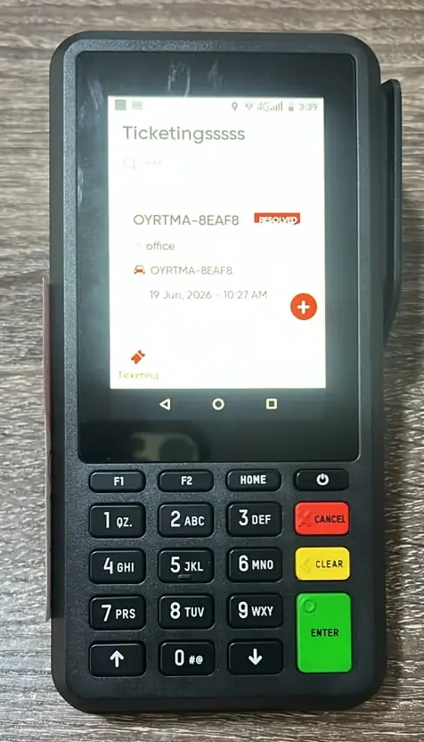 OYRTMA on a POS terminal: the ticketing screen showing a resolved ticket, with the physical keypad below.